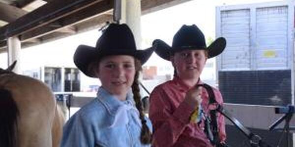 two girls in cowboy hats